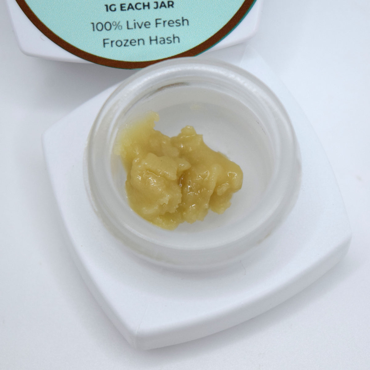 Alien OG S-Tier fresh frozen hash rosin featuring creamy off-white cold cure with a glossy terpene-rich finish and classic OG profile.