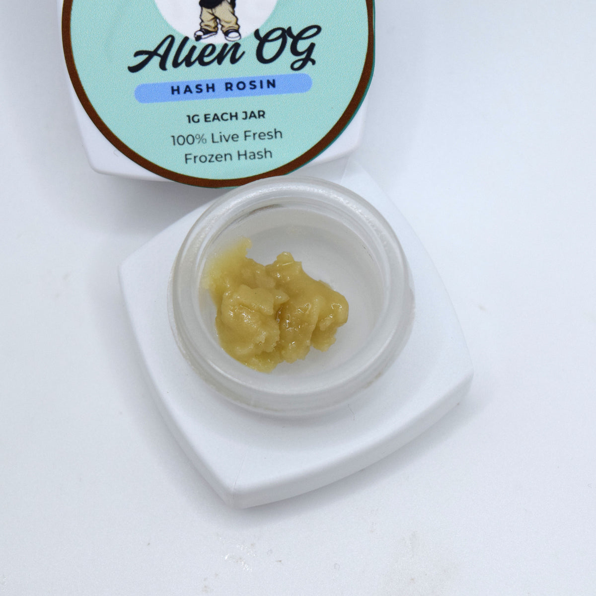 Alien OG S-Tier fresh frozen hash rosin featuring creamy off-white cold cure with a glossy terpene-rich finish and classic OG profile.