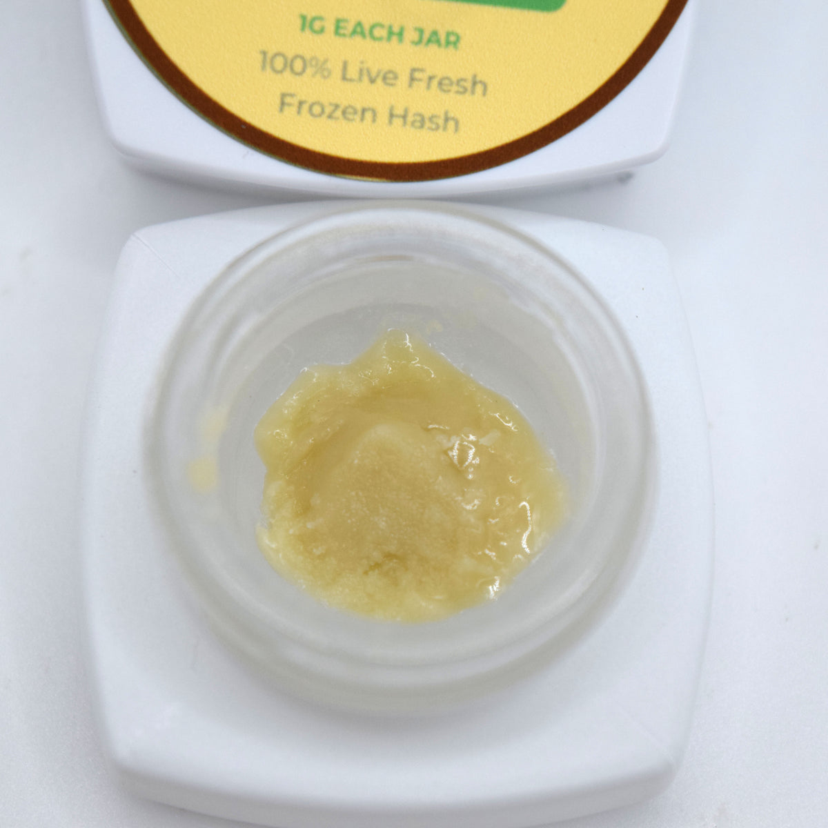 Banana Punch S-Tier fresh frozen hash rosin featuring a pale creamy cold cure with a glossy terpene-rich sheen.