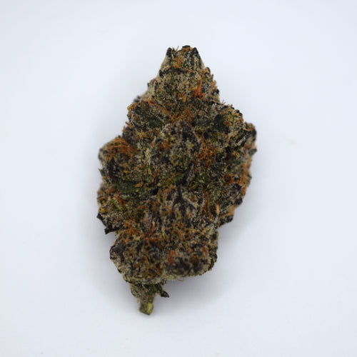 Black Magic Craft THCa flower with dark purple-black resinous buds and a rich berry, grape, citrus, earthy spice, and woody aroma profile.