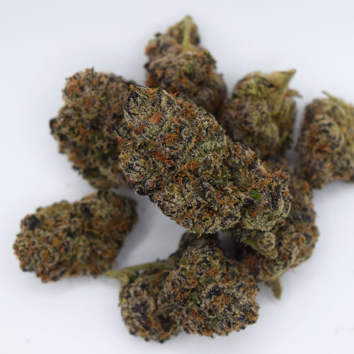 Black Magic Craft THCa flower with dark purple-black resinous buds and a rich berry, grape, citrus, earthy spice, and woody aroma profile.