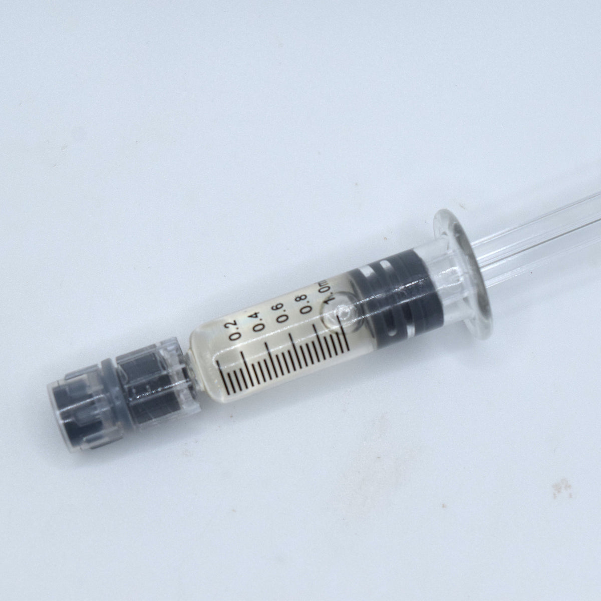 CBC Distillate featuring 95.95% cannabichromene in a graduated syringe. High-purity, pale-gold CBC concentrate for targeted cannabinoid formulations and blends.