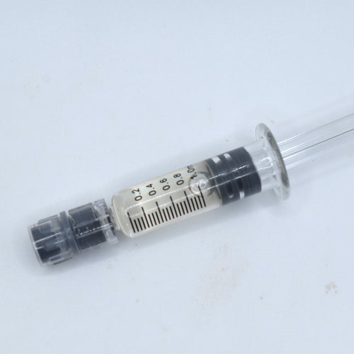 CBC Distillate featuring 95.95% cannabichromene in a graduated syringe. High-purity, pale-gold CBC concentrate for targeted cannabinoid formulations and blends.