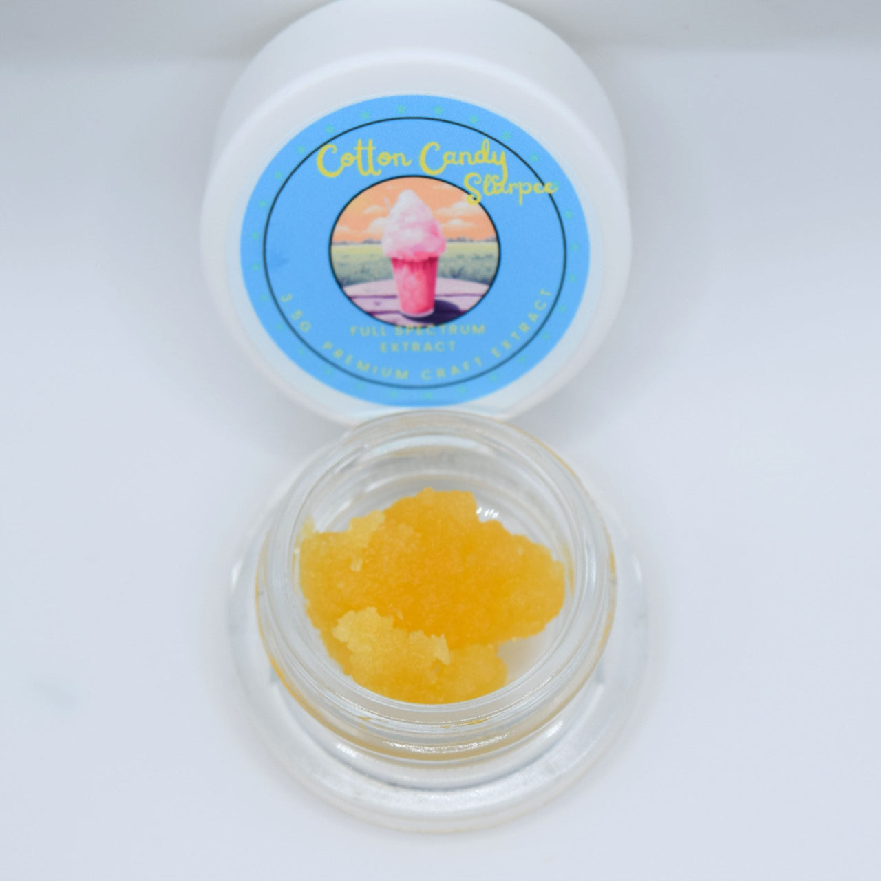 Cotton Candy Slurpee THCa live resin with glossy golden terpene-rich extract featuring sweet cotton candy, berry, citrus, and creamy vanilla aroma profile.