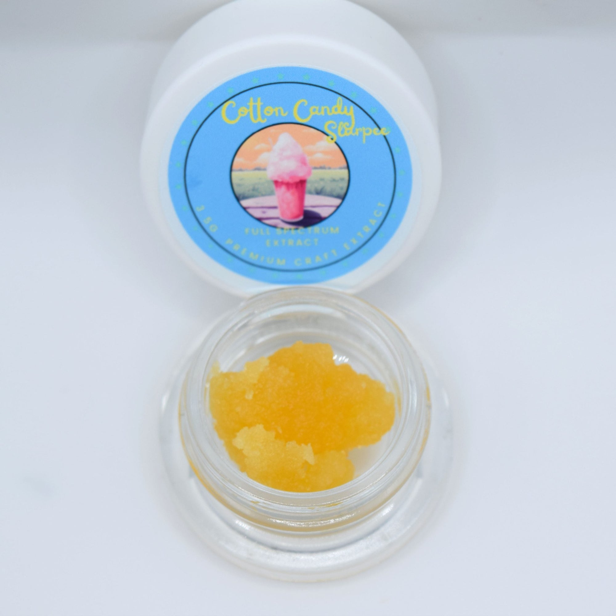 Cotton Candy Slurpee THCa live resin with glossy golden terpene-rich extract featuring sweet cotton candy, berry, citrus, and creamy vanilla aroma profile.