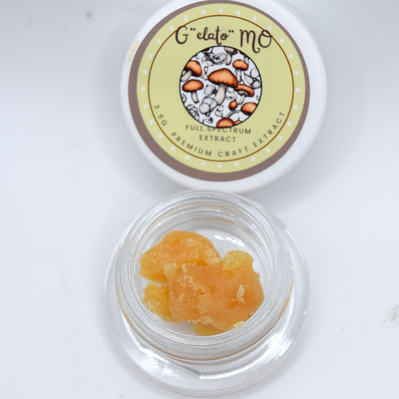 Gelato x GMO THCa full spectrum extract with golden amber terpene-rich consistency and creamy garlic gas aroma profile.