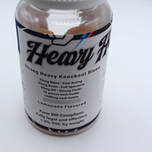 Heavy Hitter 100mg THC gummy featuring 25mg nano Delta-9, 25mg full spectrum resin, and 50mg Delta-9 THC in a triple-phase high-potency formula.