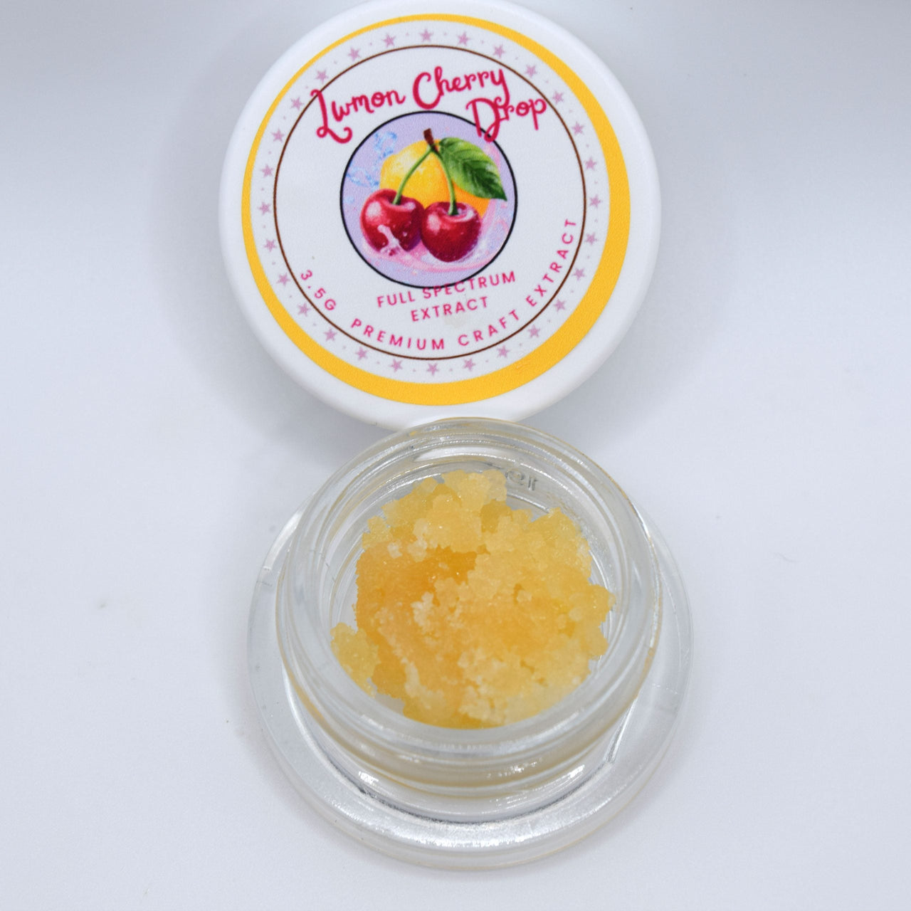 Lemon Cherry Drop THCa live extract with glossy golden resin and a tart cherry candy, lemon citrus, creamy earth, and soft gas profile.