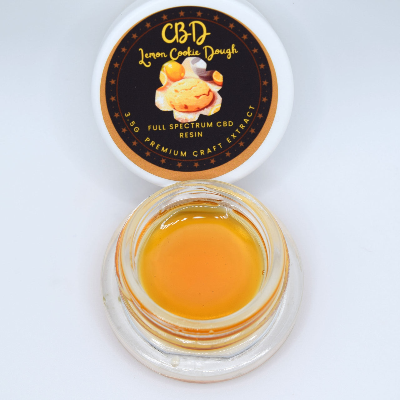 Lemon Cookie Dough CBD full spectrum extract with glossy golden amber resin and a tart lemon, sweet cookie dough, herbal Kush, woody pepper, and diesel profile.