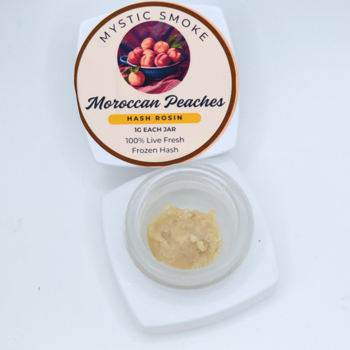Moroccan Peaches A+ fresh frozen hash rosin featuring a pale, slightly drier cold-cure texture with terpene-rich peach and citrus character.