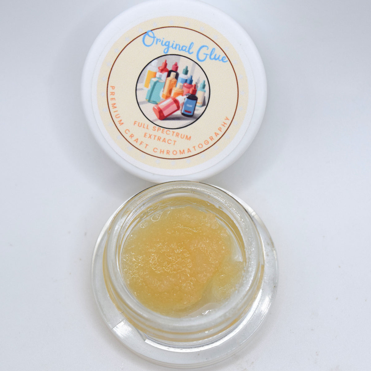 Original Glue GG4 First Fraction THCa Live Resin featuring a wet glossy consistency and terpene-rich sour diesel, pine, earth, and chem profile.