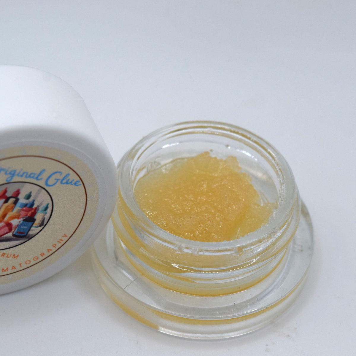 Original Glue GG4 First Fraction THCa Live Resin featuring a wet glossy consistency and terpene-rich sour diesel, pine, earth, and chem profile.