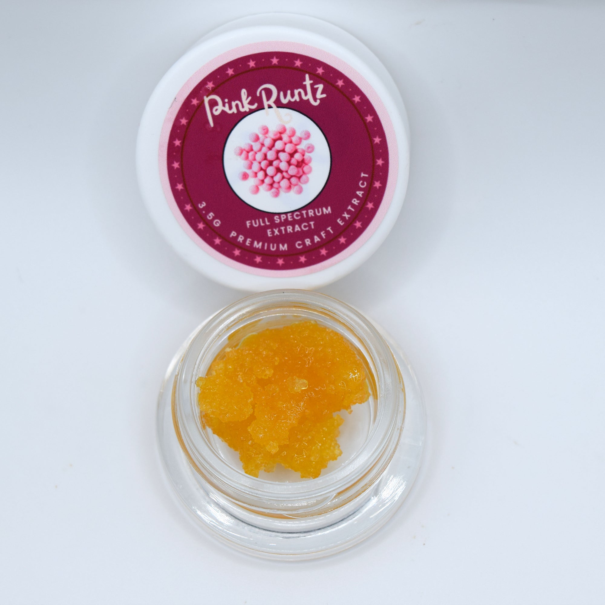 Pink Runtz THCa Full Spectrum Extract with golden resinous texture and floral rose, berry, cherry, tropical fruit, cream, and sour candy aroma.