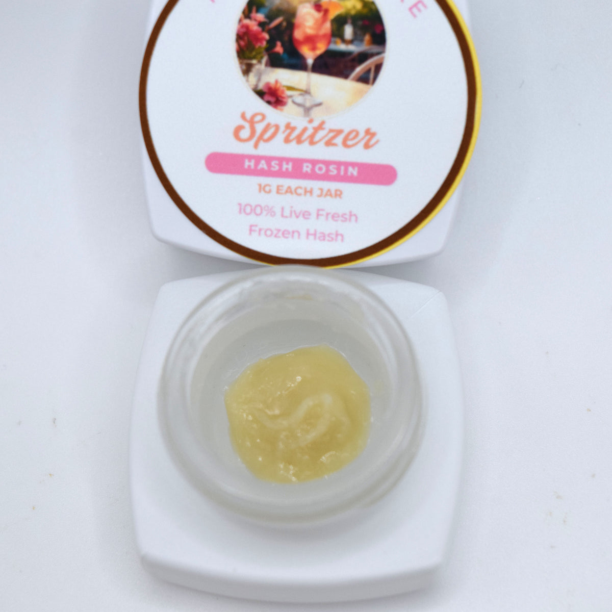 Spritzer S-Tier fresh frozen hash rosin featuring creamy off-white cold cure with a glossy terpene-rich finish.
