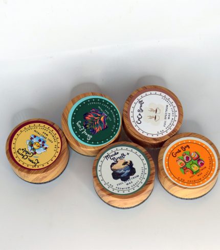 Golden full spectrum wax with waxy crumble texture in a bulk container, labeled Mixed Strains.