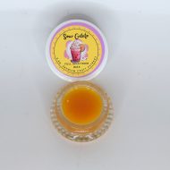 Amber Sour Gelato full spectrum extract in glass jar with waxy sugar texture labeled “Sour Gelato FSE”.