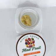 Golden Mad Fruit live hash rosin in jar with glossy terpene-rich texture labeled “S-Tier Live Rosin”.