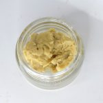 Golden Mad Fruit live hash rosin in jar with glossy terpene-rich texture labeled “S-Tier Live Rosin”.