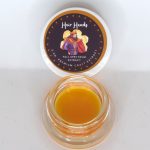 Amber Heir Heads THCa HTFSE sauce with rich terpene oil and glossy texture labeled “Heir Heads HTFSE”.