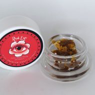 Golden unfiltered Red Eye THCa live resin with saucy texture and terpene sheen.