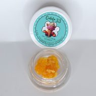 Gelato 33 THCa full spectrum extract showing creamy terpene sauce with fine sugar crystalline texture.