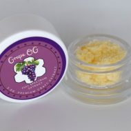 Grape OG THCa full spectrum extract showing amber terpene sauce with crystalline THCa and resin sheen.