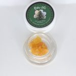 Kosher OG THCa full spectrum extract showing amber terpene sauce with crystalline THCa and resin depth.