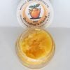 Mystic Smoke cured resin bulk extract in 1oz jar showing light amber multi-strain concentrate texture.