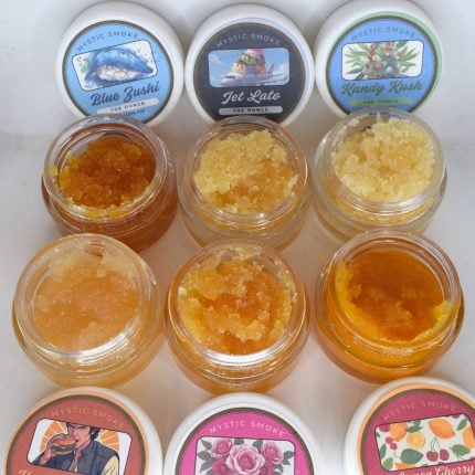 Bulk THCa live resin full spectrum extract showing large quantity of terpene-rich sauce or sugar in container.