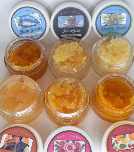 Bulk THCa live resin full spectrum extract showing large quantity of terpene-rich sauce or sugar in container.