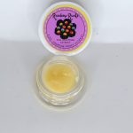 Rainbow Runtz THCa full spectrum extract badder showing creamy whipped concentrate texture with pale gold color.
