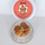 Sherbet THCa cured crumble full spectrum extract showing light gold crumbly concentrate texture.