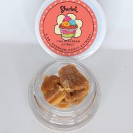 Sherbet THCa cured crumble full spectrum extract showing light gold crumbly concentrate texture.