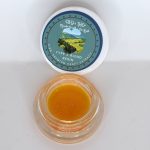 Type 2 CBD THCa full spectrum extract showing golden terpene-rich consistency with creamy and citrus kush profile.