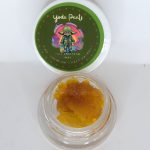 Yoda Pants THCa full spectrum extract showing amber terpene sauce with crystalline THCa structure and resin depth.