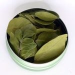Dried evergreen sumac botanical smoking herb prepared for blending with hemp flower and herbal smoke mixtures.