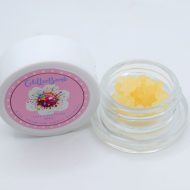 Glitter Bomb THCa full spectrum soft sugar showing golden crystalline extract with grape, blueberry, gas, and kush aroma profile.
