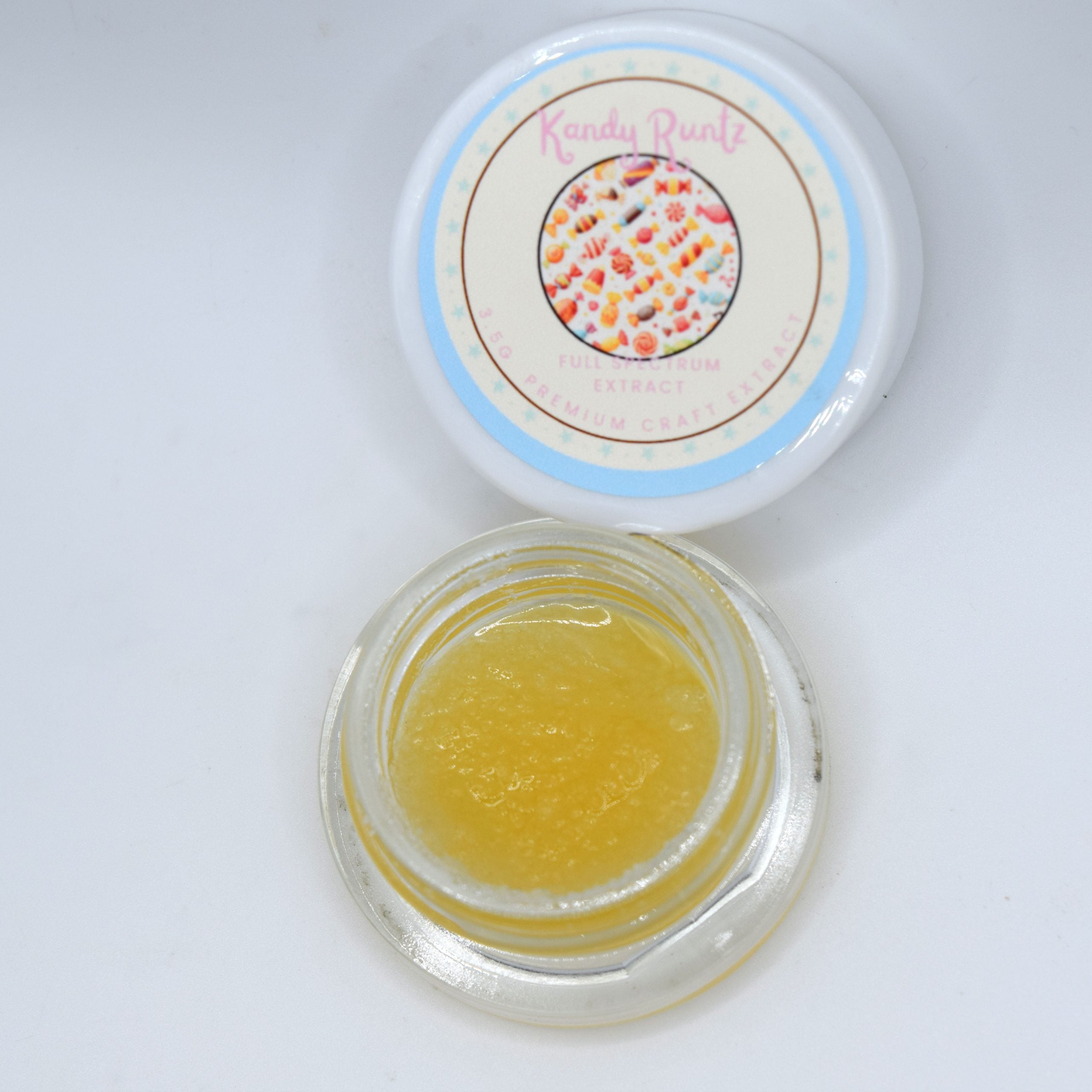 Kandy Runtz THCa wet live resin with golden glossy terpene-rich extract and sweet candy fruit aroma profile.