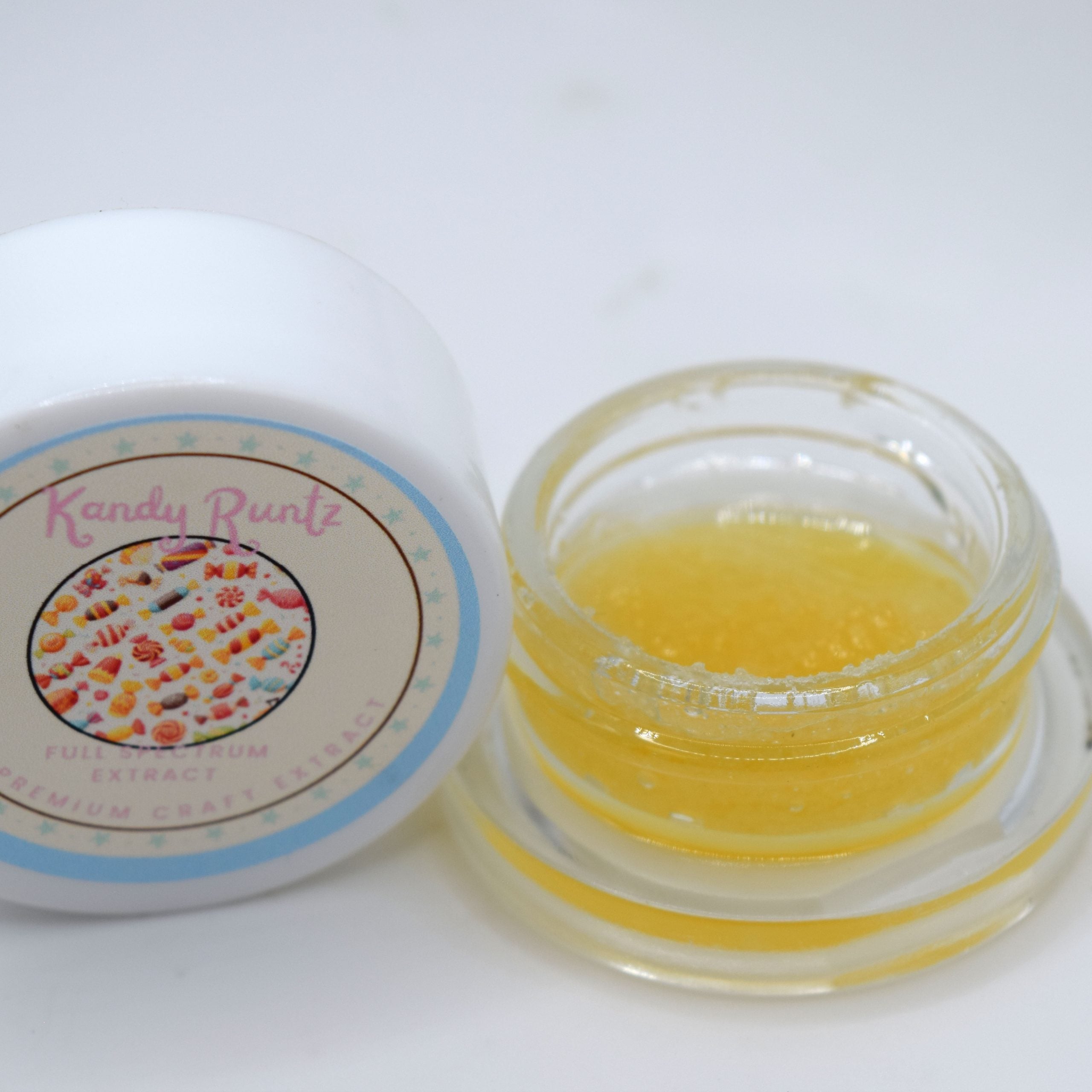Kandy Runtz THCa wet live resin with golden glossy terpene-rich extract and sweet candy fruit aroma profile.